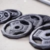 Discos de pesas de 1 Pulgada variados para barra y mancuernas.